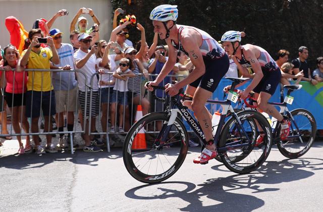 Britain's Alistair Brownlee and his brother Jonathan Brownlee (right) compete in the men's triathlon along Copacabana beach at the Summer Olympics in Rio de Janeiro on Thursday. Triathlon involves ocean swimming, 24-mile cycling and 6.2 mile running. (AP) Britain's Alistair Brownlee and his brother Jonathan Brownlee (right) compete in the men's triathlon along Copacabana beach at the Summer Olympics in Rio de Janeiro on Thursday. Triathlon involves ocean swimming, 24-mile cycling and 6.2 mile running. (AP)