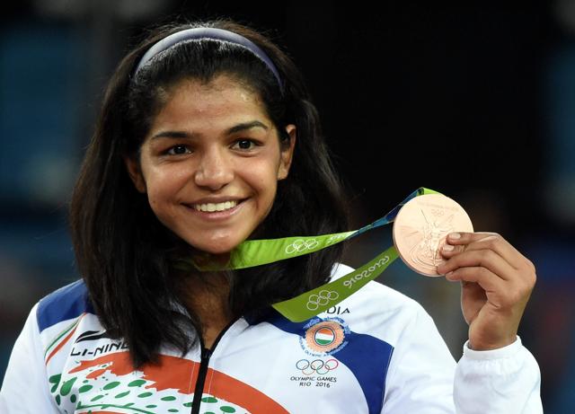 Sakshi Malik poses with her bronze medal for the women's wrestling freestyle 58-kg competition at the 2016 Summer Olympics in Rio de Janeiro (PTI) Sakshi Malik poses with her bronze medal for the women's wrestling freestyle 58-kg competition at the 2016 Summer Olympics in Rio de Janeiro (PTI)