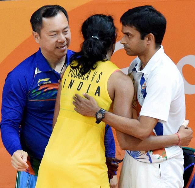 PV Sindhu celebrates with her coach Gopichand after defeating Japans Nozomi Okuhara during the womens singles semifinal match in Rio de Janeiro, Brazil. (PTI Photo) PV Sindhu celebrates with her coach Gopichand after defeating Japans Nozomi Okuhara during the womens singles semifinal match in Rio de Janeiro, Brazil. (PTI Photo)
