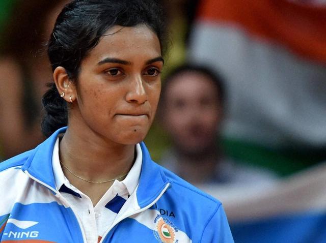 PV Sindhu poses with the national flag during the victory ceremony. (REUTERS Photo) PV Sindhu poses with the national flag during the victory ceremony. (REUTERS Photo)
