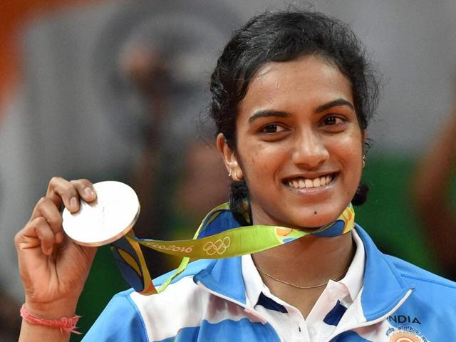 India's Pusarla V Sindhu kisses her silver medal after her match with Spain's Carolina Marin.(PTI Photo)