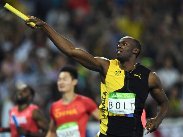 Jamaica's Usain Bolt celebrates his team's victory at the end of the Men's 4x100m Relay Final.(AFP Photo)