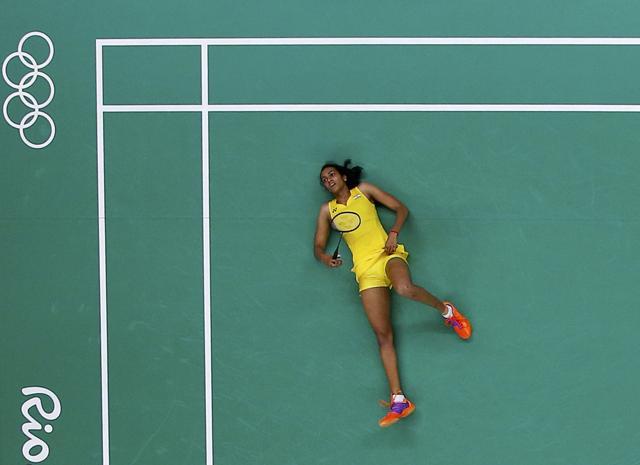 Sindhu lies on the court during her match against Carolina Marin in Rio de Janeiro, Brazil. (Reuters Photo) Sindhu lies on the court during her match against Carolina Marin in Rio de Janeiro, Brazil. (Reuters Photo)