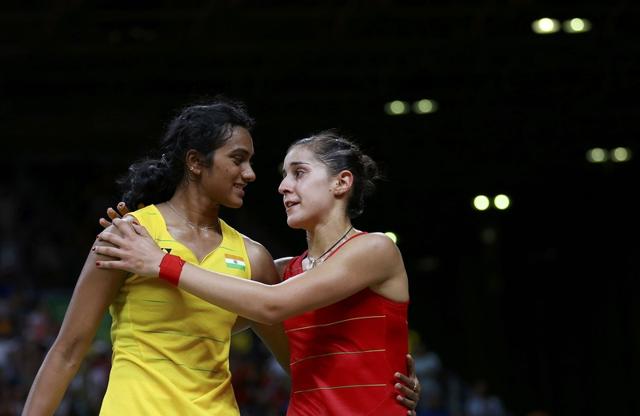 Carolina Marin embraces PV Sindhu after winning their women’s singles gold medal match. (REUTERS) Carolina Marin embraces PV Sindhu after winning their women’s singles gold medal match. (REUTERS)