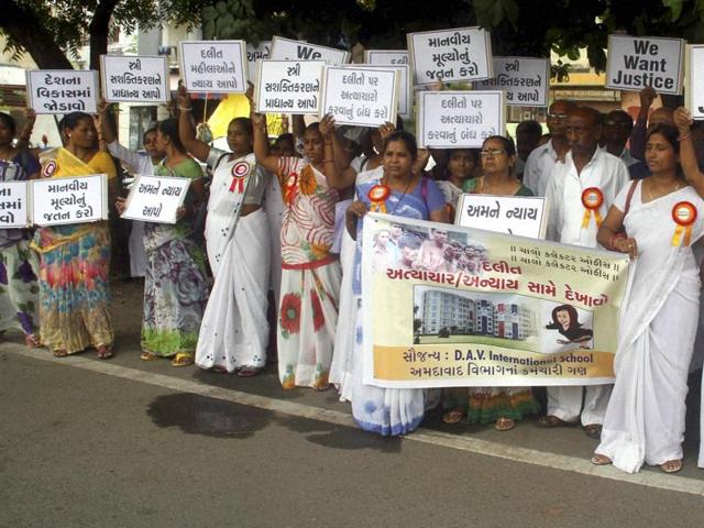 Dalits hold placards during a protest against attacks on the people of the community, in Ahmedabad on Saturday. (PTI) Dalits hold placards during a protest against attacks on the people of the community, in Ahmedabad on Saturday. (PTI)