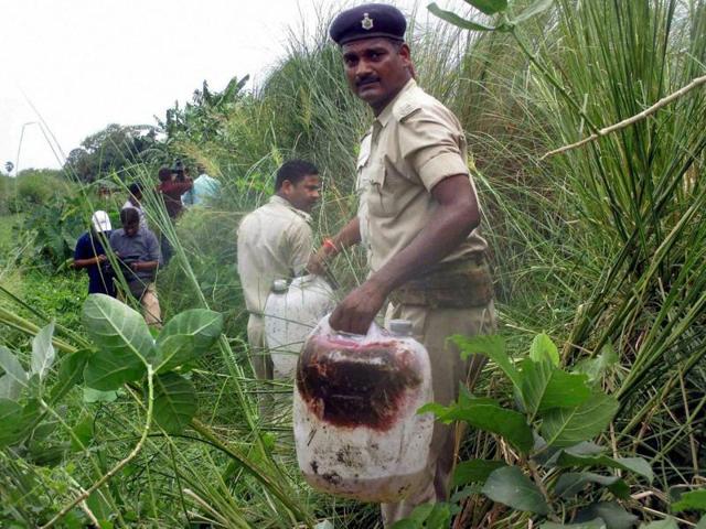 Policemen recovered poisonous liquor in a field at Harkhua Khajurbari village in Gopalganj district of Bihar on Wednesday, August 17, 2016. (PTI) Policemen recovered poisonous liquor in a field at Harkhua Khajurbari village in Gopalganj district of Bihar on Wednesday, August 17, 2016. (PTI)