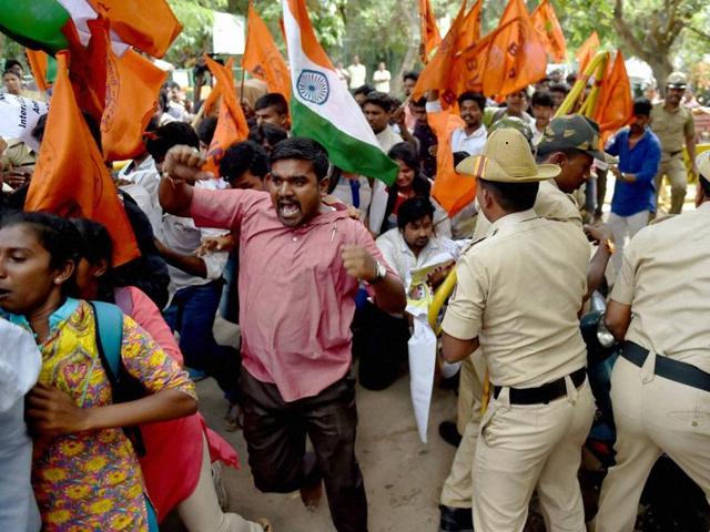 Police try to stop ABVP members who are trying to enter the Amnesty International India office during a protest demonstration in Bengaluru. (PTI) Police try to stop ABVP members who are trying to enter the Amnesty International India office during a protest demonstration in Bengaluru. (PTI)