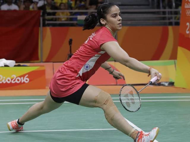 India's Saina Nehwal returns a shot to Ukrain's Maria Ulitina.(AP Photo)