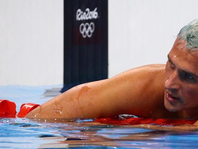 In this image made from video, American Olympic swimmers Gunnar Bentz and Jack Conger walk in the departure area after checking into their flight at the airport in Rio de Janeiro on Thursday. Brazilian police have said Ryan Lochte and three of his teammates were not robbed, and instead vandalized a gas station bathroom. Lochte had said earlier this week they were held up at gunpoint after a night of partying. (AP) In this image made from video, American Olympic swimmers Gunnar Bentz and Jack Conger walk in the departure area after checking into their flight at the airport in Rio de Janeiro on Thursday. Brazilian police have said Ryan Lochte and three of his teammates were not robbed, and instead vandalized a gas station bathroom. Lochte had said earlier this week they were held up at gunpoint after a night of partying. (AP)