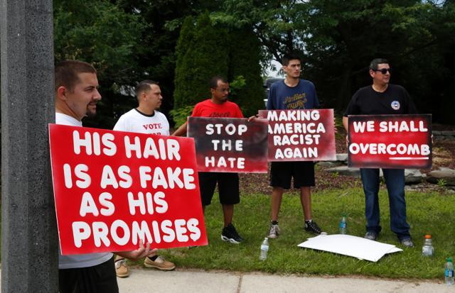 Protestors gather outside a rally for US Republican presidential candidate Donald Trump in Michigan on Friday. (AFP) Protestors gather outside a rally for US Republican presidential candidate Donald Trump in Michigan on Friday. (AFP)