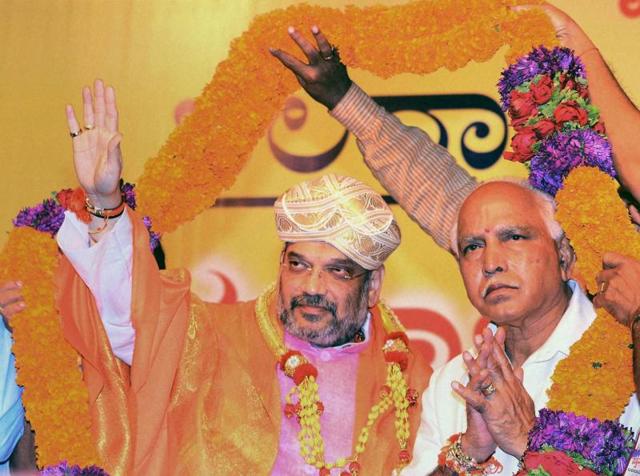 BJP national president Amit Shah and Karnataka state president BS Yeddyurappa at party workers' convention in Mangaluru on Sunday. (PTI) BJP national president Amit Shah and Karnataka state president BS Yeddyurappa at party workers' convention in Mangaluru on Sunday. (PTI)