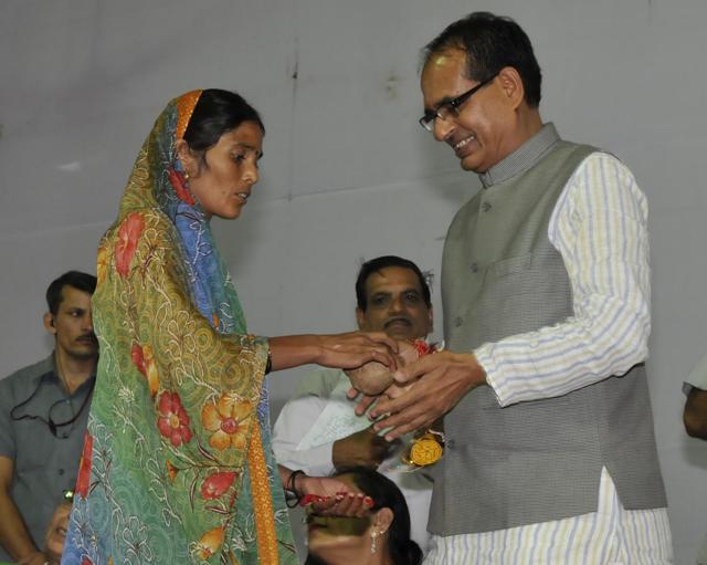 In 2014 Sarpanch of village purawas kalan of Morena district Badami Bai, who is a dalit, tied rakhi on chief minister Shivraj singh chouhan`s wrist an apprised him of discrimination she is facing due to hegemony of former sarpanch, a Thakur by cast . in Bhopal, India, on Sunday, August 10, 2014. (Mujeeb Faruqui/ Hindustan Times) In 2014 Sarpanch of village purawas kalan of Morena district Badami Bai, who is a dalit, tied rakhi on chief minister Shivraj singh chouhan`s wrist an apprised him of discrimination she is facing due to hegemony of former sarpanch, a Thakur by cast . in Bhopal, India, on Sunday, August 10, 2014. (Mujeeb Faruqui/ Hindustan Times)