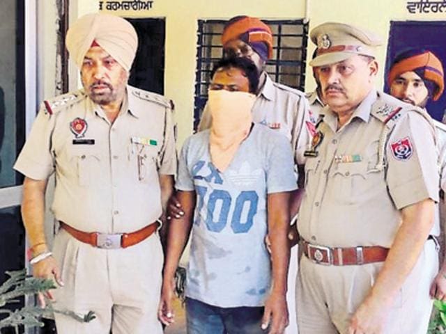 On Sunday, police arrested Inderjeet Singh (30) of Rihana Jatta, Kapurthala, for killing Gurpreet Chumbar, whose body with hands and legs tied was found in the almirah of a neighbour.(HT Photo)