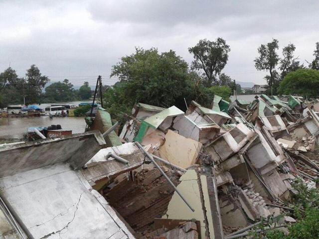 A three storied building collapsed in Maihar town of Satna. At least two persons were buried alive five others were hurt severely. A few others are still feared trapped in the debris....ht photo (HT Photo) A three storied building collapsed in Maihar town of Satna. At least two persons were buried alive five others were hurt severely. A few others are still feared trapped in the debris....ht photo (HT Photo)