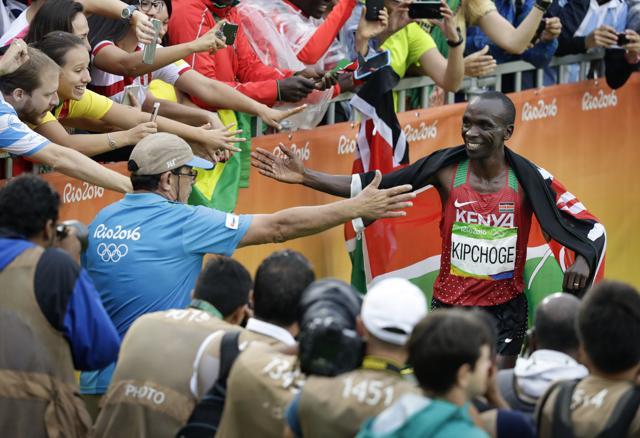 Eliud Kipchoge, of Kenya, is congratulated after winning the men's marathon at the 2016 Summer Olympics in Rio de Janeiro, Brazil, onSunday. (AP) Eliud Kipchoge, of Kenya, is congratulated after winning the men's marathon at the 2016 Summer Olympics in Rio de Janeiro, Brazil, onSunday. (AP)
