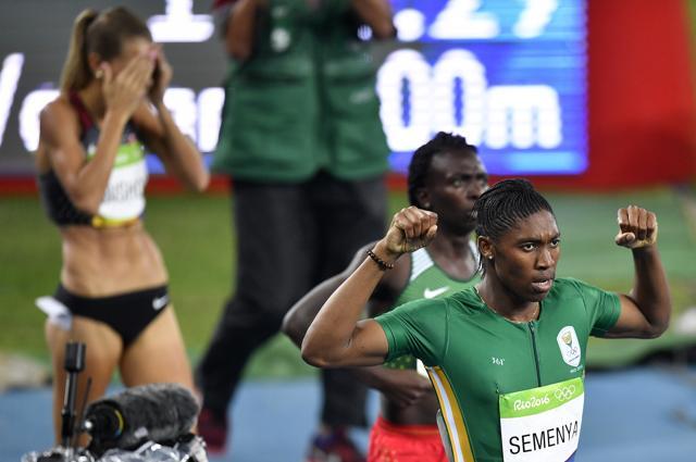 South Africa's Caster Semenya celebrates winning the gold medal in the women's 800-metre final as fourth placed Canada's Melissa Bishop covers her face. (AP) South Africa's Caster Semenya celebrates winning the gold medal in the women's 800-metre final as fourth placed Canada's Melissa Bishop covers her face. (AP)