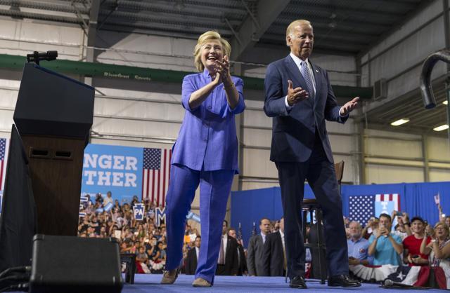 Hillary Clinton, the Democratic presidential nominee, campaigns with American Vice president Joe Biden during a rally at the Riverfront Sports Complex in Scranton. She chose a signature monotone pantsuit for the event. (NYT/Ruth Fremson/)