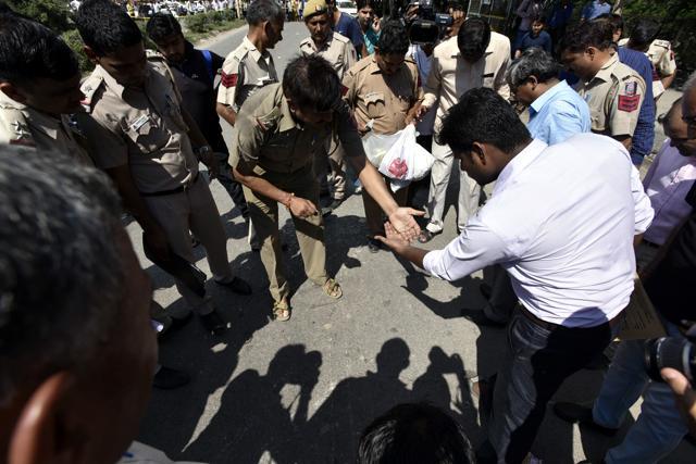 A Delhi Police collects samples from a spot where a shootout between the Delhi police and wanted criminals took place in Rohini on Sunday. (Arun Sharma/HT Photo) A Delhi Police collects samples from a spot where a shootout between the Delhi police and wanted criminals took place in Rohini on Sunday. (Arun Sharma/HT Photo)