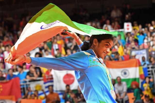 Silver medallist Pusarla V Sindhu celebrates on the podium following the women's singles badminton final at the Riocentro stadium in Rio de Janeiro. (AFP) Silver medallist Pusarla V Sindhu celebrates on the podium following the women's singles badminton final at the Riocentro stadium in Rio de Janeiro. (AFP)