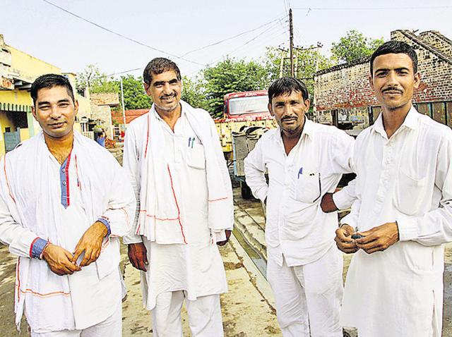 Male family members of woman sarpanch Laxmi Devi have taken over her civic responsibilities, ensuring Devi remains nothing more than a housewife. In the same breath, ‘inspired by Sakshi Malik’, they say they will work towards ending gender bias.(Manoj Dhaka/HT Photo) Male family members of woman sarpanch Laxmi Devi have taken over her civic responsibilities, ensuring Devi remains nothing more than a housewife. In the same breath, ‘inspired by Sakshi Malik’, they say they will work towards ending gender bias.(Manoj Dhaka/HT Photo)