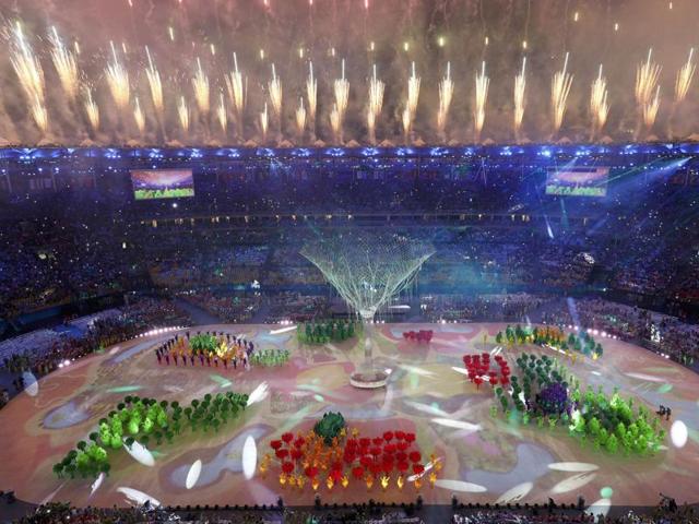After the Olympic flame is extinguished, performers participate in the final segment of the ceremony. (REUTERS)