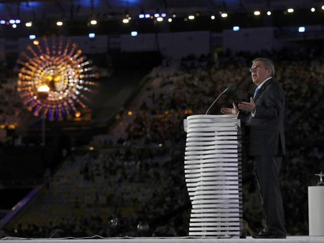 International Olympic Committee President Thomas Bach delivers the closing speech, ending with “Bye bye, Rio.” The Olympic flame in the background was then extinguished. (REUTERS)