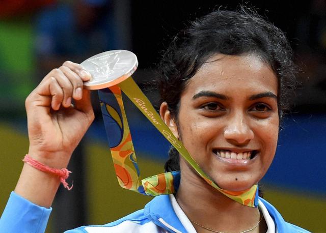India's Pusarla V Sindhu poses with her silver medal after her match with Spain's Carolina Marin. (PTI Photo) India's Pusarla V Sindhu poses with her silver medal after her match with Spain's Carolina Marin. (PTI Photo)