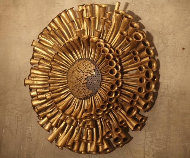 Narayan Sinha’s sculpture Man, Machine &amp; Nature – III is created in brass and mix metal.