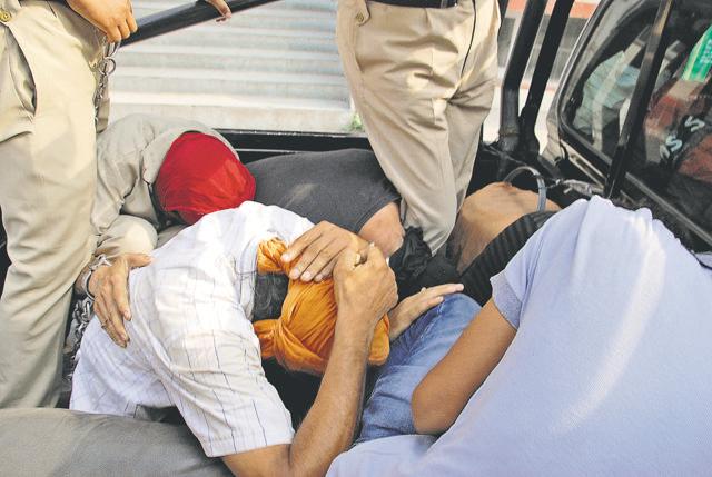 The five accused—Jasminder Singh, a head constable with the IB; Manjit Singh, a constable with the CBI; Varun Sareen, an employee with the Suvidha Centre of DC office; Paramjit Singh, a relative of Jasminder and one Manmohan Singh, a driver. (Sameer Sehgal/HT Photo)
