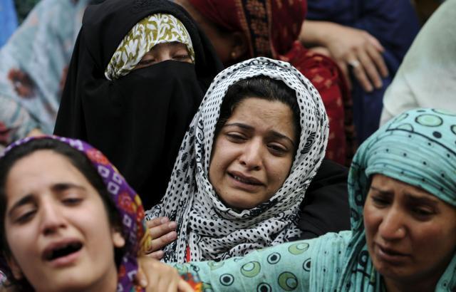 Relatives of Irfan Ahmad,, who was killed by a tear gas shell, cry as residents visit the family to offer their condolences in downtown area of Srinagar on Monday. (Waseem Andrabi/ HT Photo) Relatives of Irfan Ahmad,, who was killed by a tear gas shell, cry as residents visit the family to offer their condolences in downtown area of Srinagar on Monday. (Waseem Andrabi/ HT Photo)