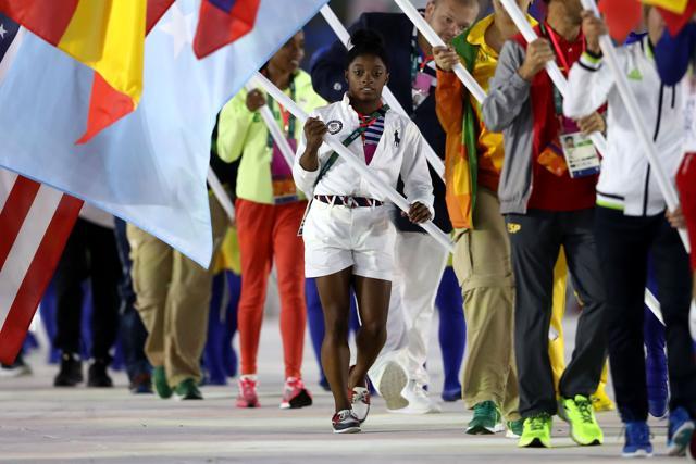 Flag bearer Simone Biles of United States walks during the ‘Heroes of the Games’ segment during the Closing Ceremony. (Getty Images)