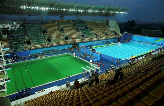 Spectators, organisers and athletes were left baffled after the Olympic diving pool turned bright green while the pool for waterpolo and synchronised swimming remained blue. The second pool turned green later, as well. (Reuters) Spectators, organisers and athletes were left baffled after the Olympic diving pool turned bright green while the pool for waterpolo and synchronised swimming remained blue. The second pool turned green later, as well. (Reuters)