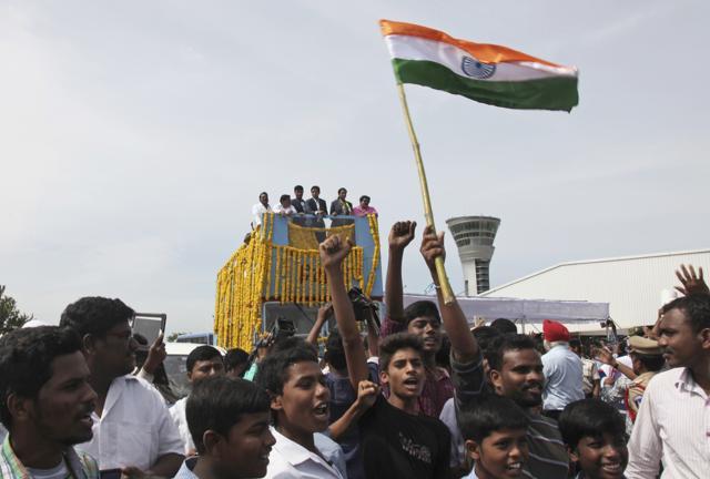 Pusarla Sindhu is brought home in a procession along with her coach, Pullela Gopichand, upon their arrival in Hyderabad. (AP)