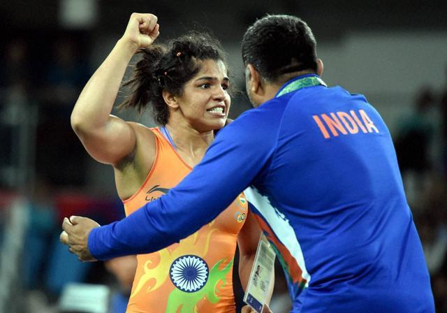 India's Sakshi Malik celebrates after winning bronze against Kyrgyzstan's Aisuluu Tynybekova. (PTI Photo) India's Sakshi Malik celebrates after winning bronze against Kyrgyzstan's Aisuluu Tynybekova. (PTI Photo)