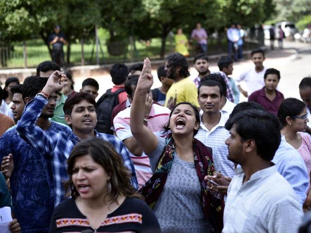 ABVP students during protest at JNU campus after 28-year-old PhD student on Sunday filed a complaint of rape against a JNU student, police said.(Arun Sharma/HT PHOTO)