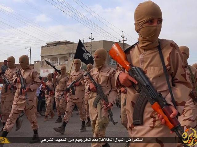 In this file photo, young boys known as Islamic State’s "lion cubs" hold rifles during a parade after graduating from a religious school in Tal Afar, near Mosul, northern Iraq. (AP)