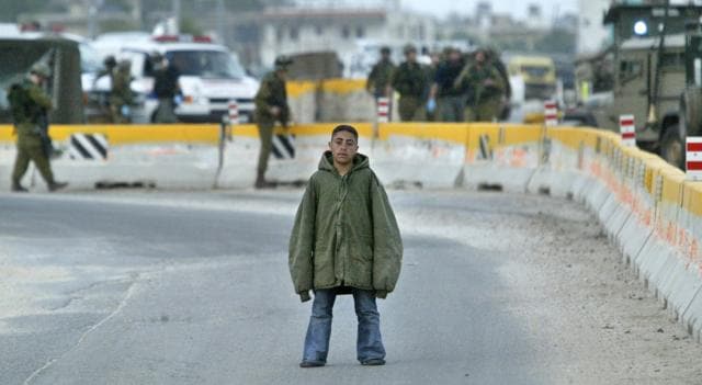 In this March 24, 2004 file photo, Palestinian youth Hussam Abdo, a would-be suicide bomber, stares at journalists as Israeli soldiers present him to the media, following his arrest at the Hawara checkpoint near the northern West Bank city of Nablus. Sappers later detonated the bomb under the jacket. (AP) In this March 24, 2004 file photo, Palestinian youth Hussam Abdo, a would-be suicide bomber, stares at journalists as Israeli soldiers present him to the media, following his arrest at the Hawara checkpoint near the northern West Bank city of Nablus. Sappers later detonated the bomb under the jacket. (AP)