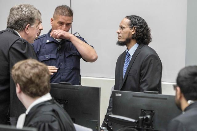 Alleged al Qaeda-linked Islamist leader Ahmad Al Faqi Al Mahdi (right) looks on during an appearance at the International Criminal Court in The Hague. (AFP Photo)