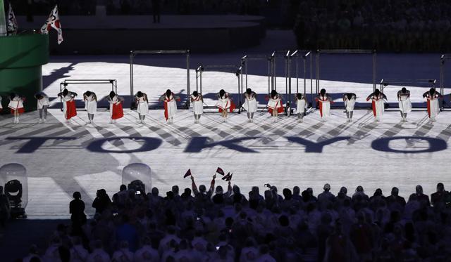2020 summer Olympic games host city, Tokyo, is projected on the floor as dancers perform during the closing ceremony. (AP)