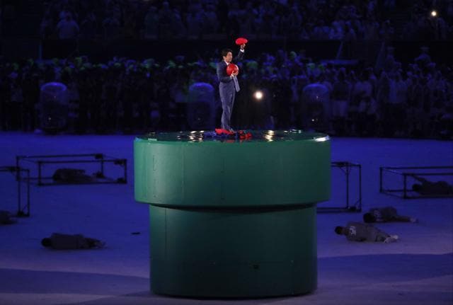 Japan's Prime Minister Shinzo Abe makes an appearance dressed as Super Mario. (AP)
