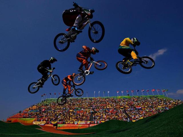 Riders compete in the Men's BMX final event at the X Park Stadium in Rio de Janeiro on August 19, 2016.  (Carl De Souza/ AFP Photo) 