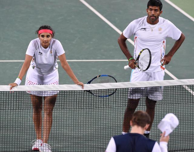 Sania Mirza-Rohan Bopanna after they beat Andy Murray and Heather Watson of Great Britain to enter semifinals of mixed doubles at Rio Olympics in Brazil. (PTI Photo) Sania Mirza-Rohan Bopanna after they beat Andy Murray and Heather Watson of Great Britain to enter semifinals of mixed doubles at Rio Olympics in Brazil. (PTI Photo)