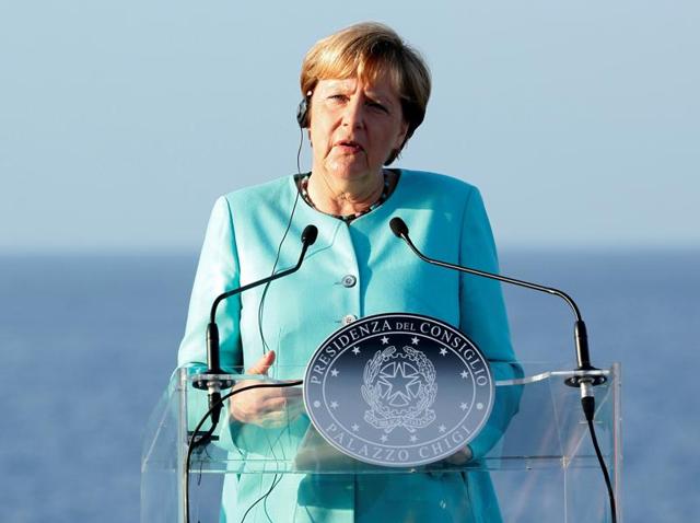 German Chancellor Angela Merkel interacts with journalists in Italy. (REUTERS) German Chancellor Angela Merkel interacts with journalists in Italy. (REUTERS)