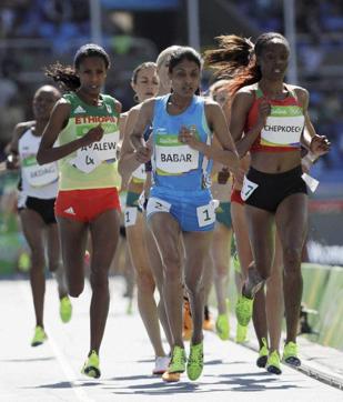 Kenya's Beatrice Chepkoech (right) and Lalita Babar (centre) competes in a women's 3000-metre steeplechase heat during the athletics competitions of Rio Olympics. (AP Photo) Kenya's Beatrice Chepkoech (right) and Lalita Babar (centre) competes in a women's 3000-metre steeplechase heat during the athletics competitions of Rio Olympics. (AP Photo)