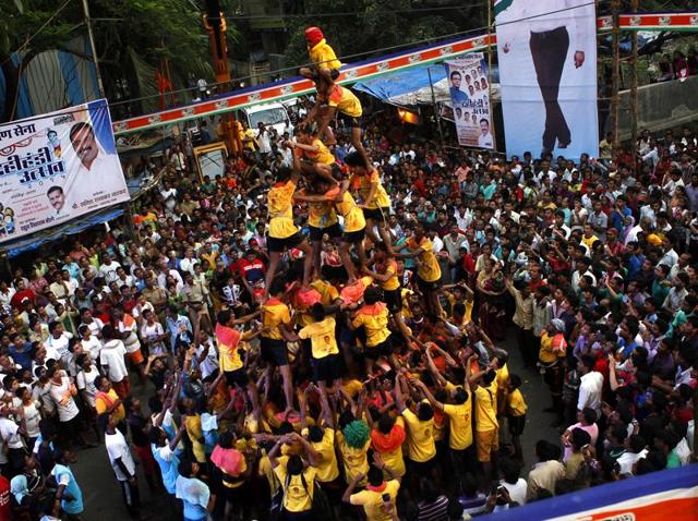 Devotees forming a human pyramid to break Dahi Handi during Janmashthami celebration at Ghatkopar (E) in Mumbai. (Arijit Sen / Hindustan Times) Devotees forming a human pyramid to break Dahi Handi during Janmashthami celebration at Ghatkopar (E) in Mumbai. (Arijit Sen / Hindustan Times)