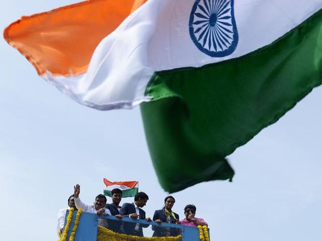 Olympic silver medallist PV Sindhu and her coach P Gopichand take part in a parade after arriving home from the Rio Olympics in Hyderabad.(AFP Photo) Olympic silver medallist PV Sindhu and her coach P Gopichand take part in a parade after arriving home from the Rio Olympics in Hyderabad.(AFP Photo)