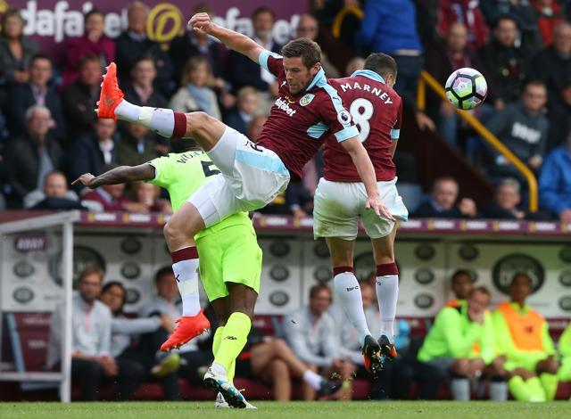 Burnley's Lukas Jutkiewicz and Dean Marney in action. (REUTERS)