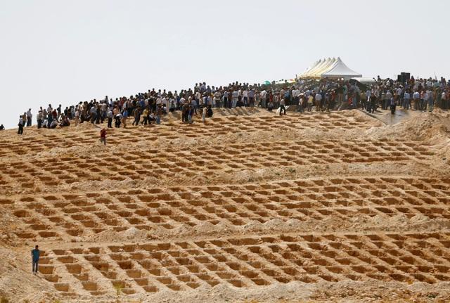 Grave holes are prepared as family members and friends attend the funeral of victims of the suicide bombing in Gaziantep. (Reuters) Grave holes are prepared as family members and friends attend the funeral of victims of the suicide bombing in Gaziantep. (Reuters)