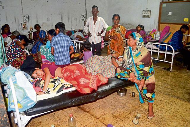 Two patients with babies share a single bed at the gynaecology ward. (Chandan Paul / HT Photo) Two patients with babies share a single bed at the gynaecology ward. (Chandan Paul / HT Photo)
