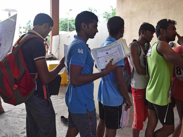 Men stand in a queue with their documents for Fire Brigade recruitment drive at Borivali in Mumbai. Candidates go through various physical tests during recruitment and get selected for training after the result of recruitment drive. After training for 6 months, 774 posts of firemen will get fulfilled through merit. (Pratham Gokhale)